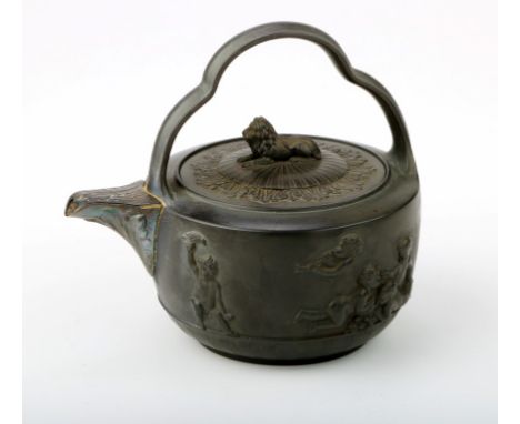 A 19th century black basalt teapot, with arched handle, above slightly domed cover with recumbent lion finial, the body decor