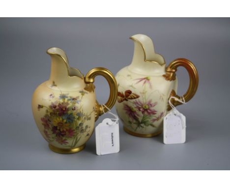 Two Royal Worcester flatback jugs, decorated with spring flowers, and one with butterfly, 13 and 15cm, puce marks