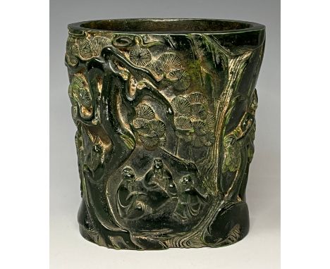 A Chinese carved green stone brush pot, possibly jade, impressed mark, 15.5cm high, 14cm wide 