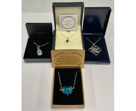 A 9ct white gold diamond chip and ruby pendant necklace, 1.2g; boxed; three sterling silver necklaces, all boxed (4) 