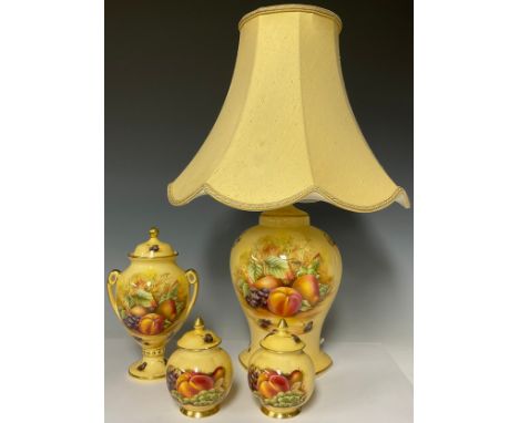 An Aynsley Orchard Gold pattern two-handled pedestal vase, 23cm high; a pair of Aynsley Orchard Gold ginger jars; an Aynsley 
