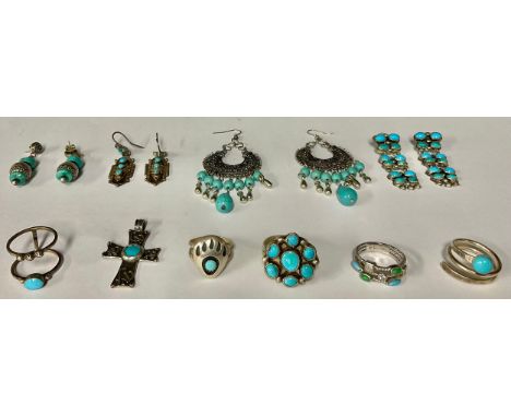 A pair of sterling silver earrings set with polished turquoise cabochons, marked 925 GM, 5cm; a sterling silver and turquoise