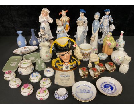 A Royal Doulton character jug, Vice-Admiral Lord Nelson, D6932, certificate, boxed; a Coalport figure, of a Flower Seller; Na