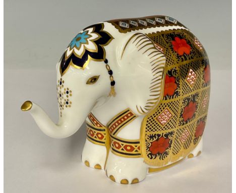 A Royal Crown Derby paperweight, Imari Elephant, trunk raised, printed in the 1128 palette, gold stopper, 10cm, printed mark 