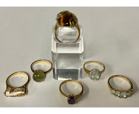 A 9ct gold QVC tiger eye fashion ring, size W, marked 375, 10g gross; five other 9ct gold QVC fashion rings, set with assorte