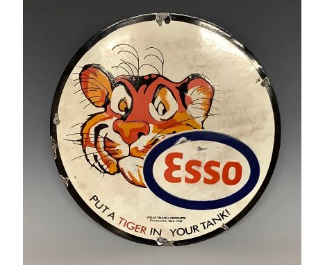 A replica enamelled circular advertising sign, Esso, Put A Tiger In Your Tank, approx. 30.5cm diameter 