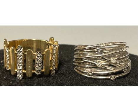 A 9k white gold QVC fashion ring, size U, 8.6g; a 9ct white and yellow gold fashion ring, of modernist design, size T, marked
