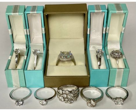 A sterling silver cubic zirconia solitaire ring, channel set small stones to shoulders, size S, marked 925, boxed; nine other