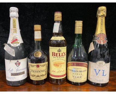 A bottle of Bell's Scotch whisky; others, Hennessy Cognac; Martini Asti-Spumante; Napoleon Brandy; Tattinger Brut Champagne (