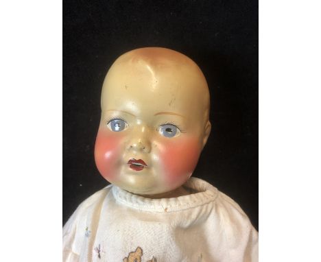 Vintage Doll - A 1930's-1940's Composition Doll, open mouth with teeth, painted hair and eyes, indistinct impressed mark to r