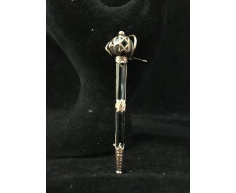 A rose gold and onyx Scottish broadsword plaid brooch, with ornate pierced and chased basket hilt and mounts over black onyx 