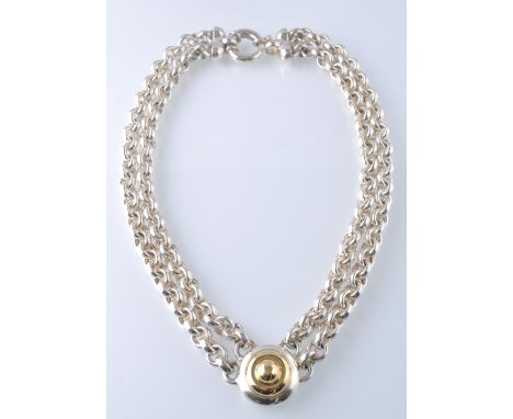 A large two string 18ct gold and 925 silver ladies necklace and pendant. The oversized twin string chain with large roundel p