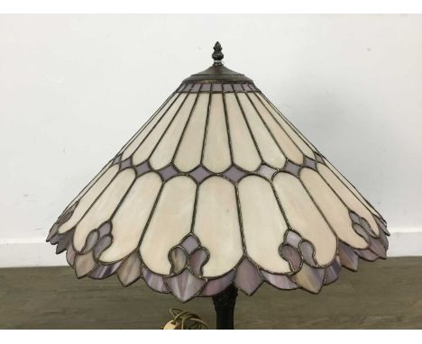 PAIR OF TIFFANY STYLE TABLE LAMPS with stained and leaded shades, together with a further similar smaller lamp on barleytwist