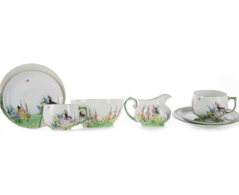 GLASGOW GIRL, HAND PAINTED PORCELAIN TEA SET EARLY 20TH CENTURY comprising twelve cups, saucers, sideplates, a sugar bowl and