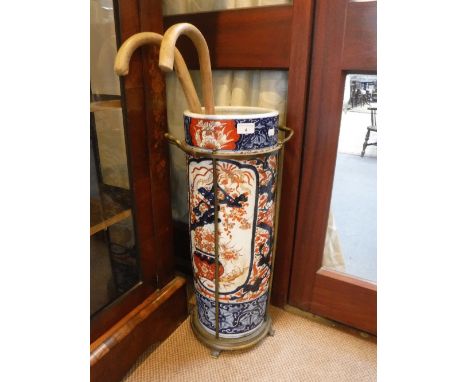 AN IMARI STICK STAND OF CYLINDRICAL FORM in an anodized brass stand 25.5" high (overall)