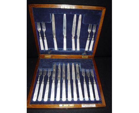 A CASED SET OF SILVER AND MOTHER-OF-PEARL HANDLED DESSERT KNIVES AND FORKS in a Bristol Goldsmith's Alliance case