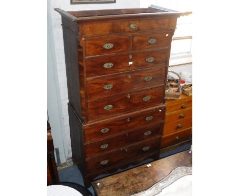 A GEORGE III MAHOGANY CHEST ON CHEST with brass handles on bracket feet