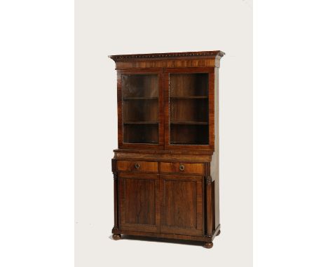 A ROSEWOOD LIBRARY CABINET decorated with bobbin turnings and panelled cupboard between turned columns, 19th century and late