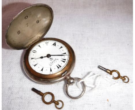 A FOREIGN SILVER CASED HUNTER POCKET WATCH, the white enamel dial with Arabic characters and arrowhead hour pointers with bel