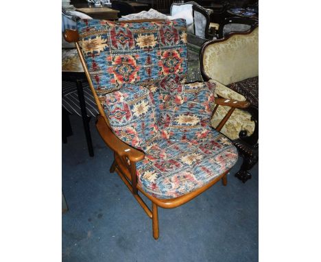 ERCOL: A LIGHT STAINED BEECH COME BACK ARMCHAIR with loose cushions