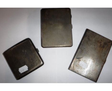 TWO ENGINE-TURNED CIGARETTE CASES and a smaller hip-shaped example (3)
