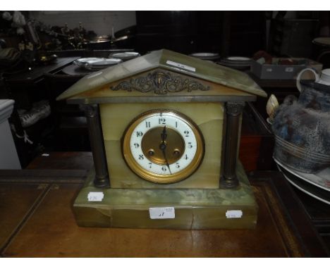 A VICTORIAN ONYX MANTEL CLOCK of architectural form
