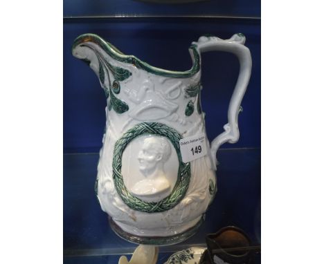A DECORATIVE CERAMIC JUG decorated with a bust of Wellington to either side