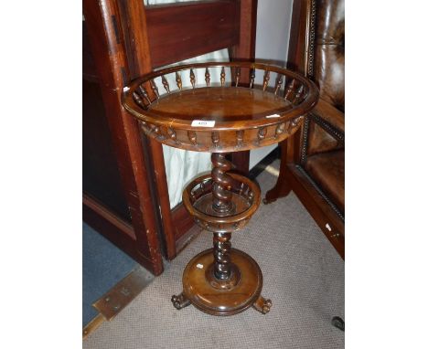 A VICTORIAN ROSEWOOD WORK STAND with a circular top with bobbin turned gallery 17.5" diameter