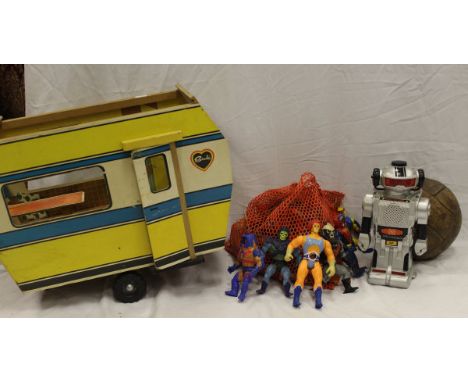 A box of various toys including "He Man" figures, vintage Sindy Caravan, etc.