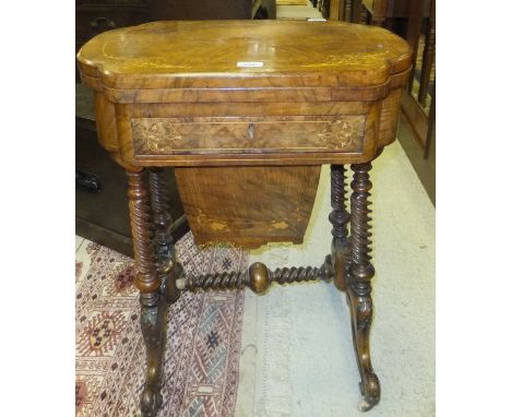 A Victorian walnut and marquetry inlaid work table, the fold over games top inlaid with chess and backgammon boards over a sl