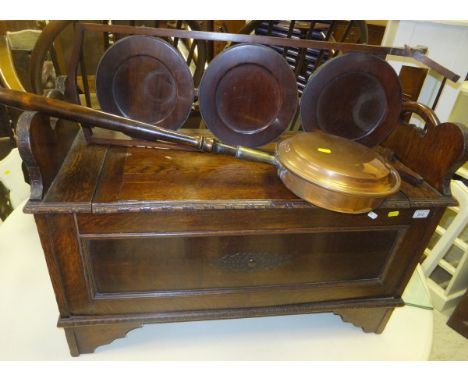 A 1930's oak box seat hall bench, a copper warming pan with turned wood handle, and a three tier mahogany folding cake stand 