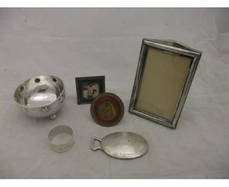 An Arts and Crafts style silver bowl (Birmingham, 1908), together with a silver mounted hand mirror, a silver napkin ring, a 