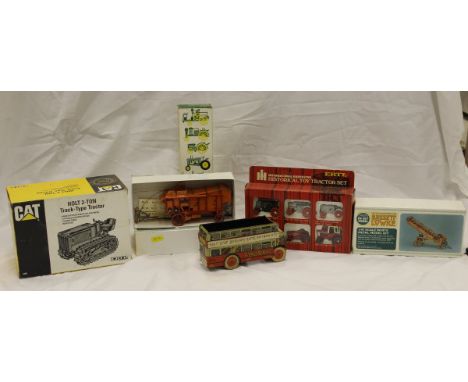 A collection of model farm machinery to include vintage tractors, modern tractors, a wind up bus etc.
