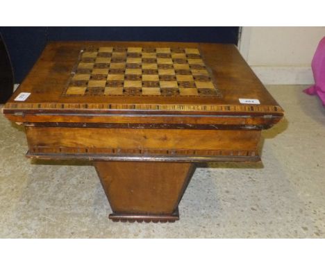 A walnut and inlaid games work table with parquetry inlaid chess board to top, opening to reveal a card table swivelling and 