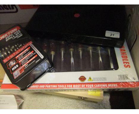 Two chisel sets, a 25 piece drill set and a 40 piece Power Impact bit set *