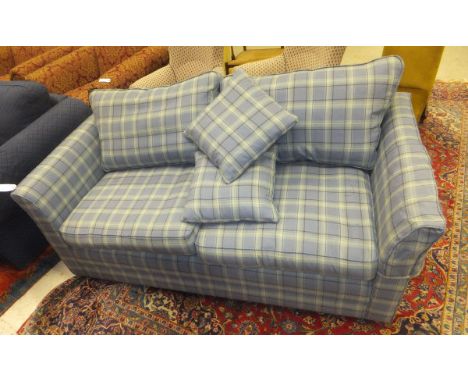 A modern scroll arm sofa upholstered in pale blue tartan fabric, together with a large quantity of scatter cushions to includ