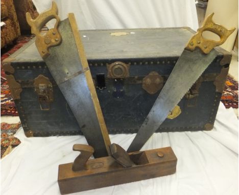 A steamer trunk and contents of various vintage hand tools, to include saws, planes, a 2¼"  block plane marked "Toga British 