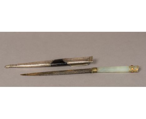 A 19th century Persian jade handled dagger
The handle with gilt detailing and ruby cabochons, housed in a white metal mounted