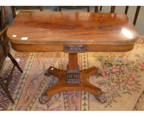 An early Victorian mahogany fold over card table 