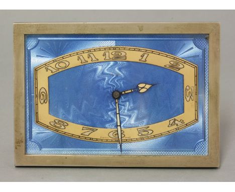 An Art Deco blue enamelled strut clock, with a gilt chapter ring and an easel back, stamped 'D‚pos‚', 16.5cm wide