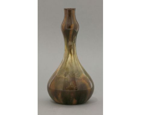 A Linthorpe Pottery vase, of double gourd shape in mottled brown and green trailed glazes, impressed shape no. 189, Ch Dresse