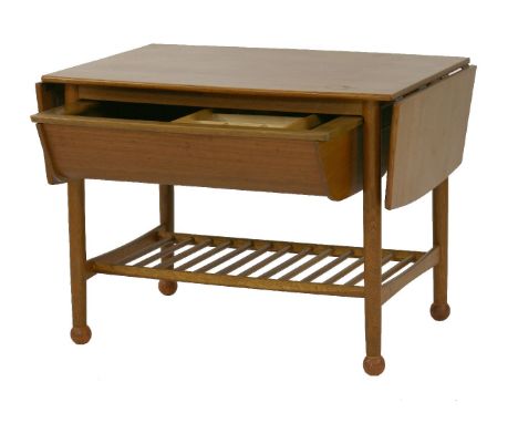 A teak drop-leaf coffee table, with a trough below, fitted with a sliding tray, over a slatted undertier, on ball feet, 78cm 