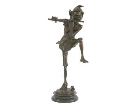 A figure of an imp,  modelled playing a flute, on circular base with toadstool and black imitation marble circular plinth, br