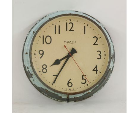 A large Magneta electric wall clock, grey finish with remnants of light blue paintwork, 54cm diameter