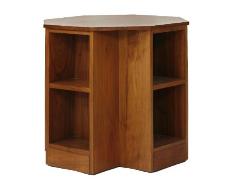 A walnut octagonal book table, by Gordon Russell, the plain top over two shelves on four sides, with a paper label reading 'R