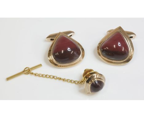 A pair of 9ct gold jasper cufflinks, c.1970, by Albion Craft and Co. Ltd., composed of a pear shaped cabochon jasper, rub set