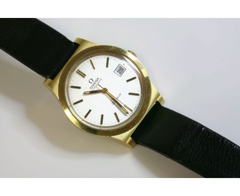 A gentlemen's gold-plated Omega Automatic GenŠve strap watch, c.1970, the case 37mm diameter, with a silvered dial, raised gi