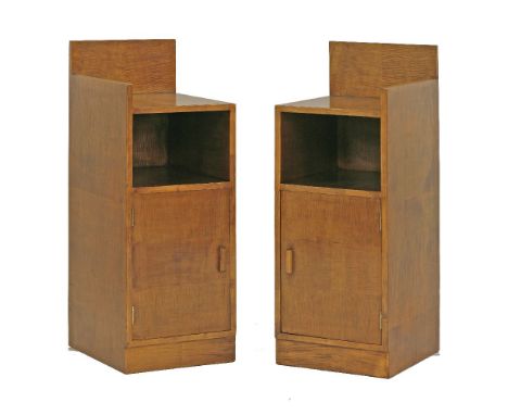 A pair of Art Deco sycamore bedside cupboards, with a high back, a shelf over a cupboard, on a raised plinth, 34cm wide 39.5c