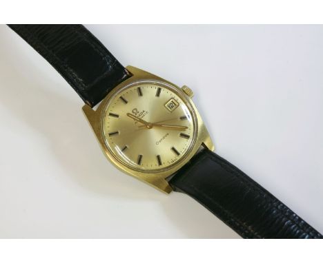 A gentlemen's gold-plated Omega Automatic GenŠve strap watch, c.1960, the case 34mm diameter, with a champagne dial, raised g