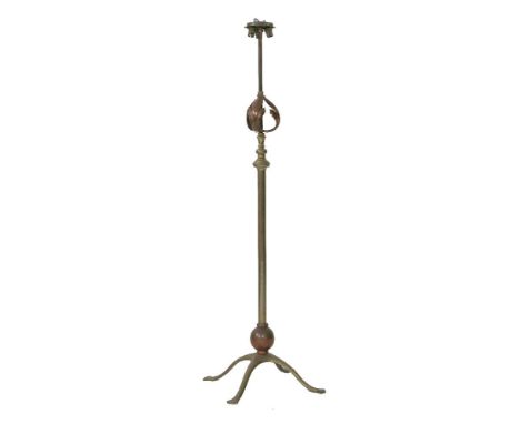 A WAS Benson brass and copper standard lamp, the three-light fitting on a telescopic column, with copper leaf details, on a f